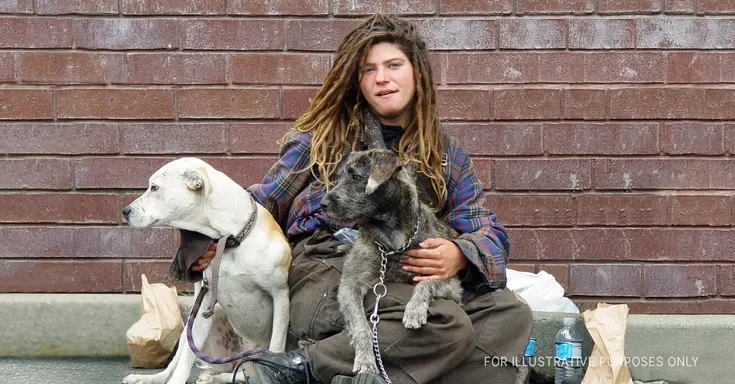 Woman with two dogs | Source: Flickr/Franco Folini (CC BY-SA 2.0)