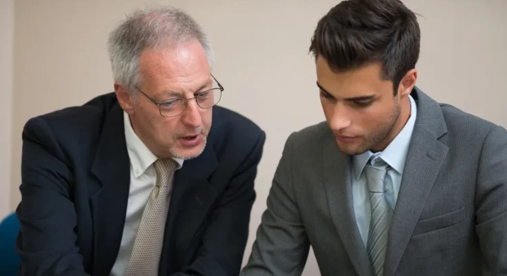 Two men in suits | Source: Shutterstock