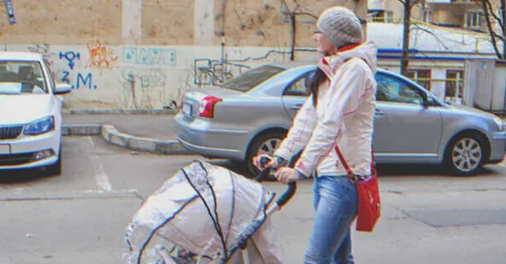 Girl pushing a baby Stroller | Source: Shutterstock