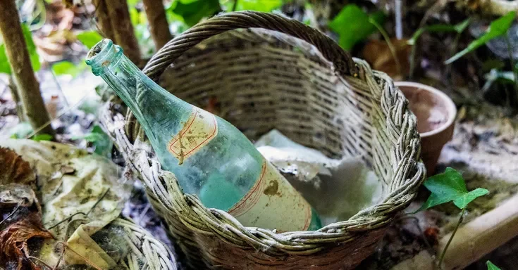 An old glass bottle in a basket | Source: Getty Images