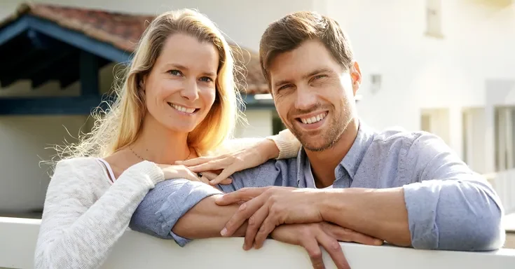 A smiling man and woman | Source: Shutterstock