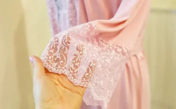 A woman touching pink fabric | Source: Shutterstock