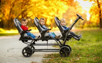 Cheerful triplets in a park. | Source: Shutterstock