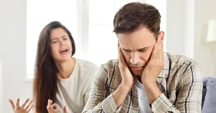 A frustrated woman yelling at a man | Source: Shutterstock