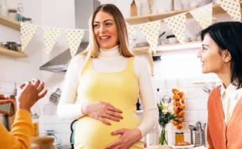 Pregnant woman bonding with her friends | Source: Getty Images