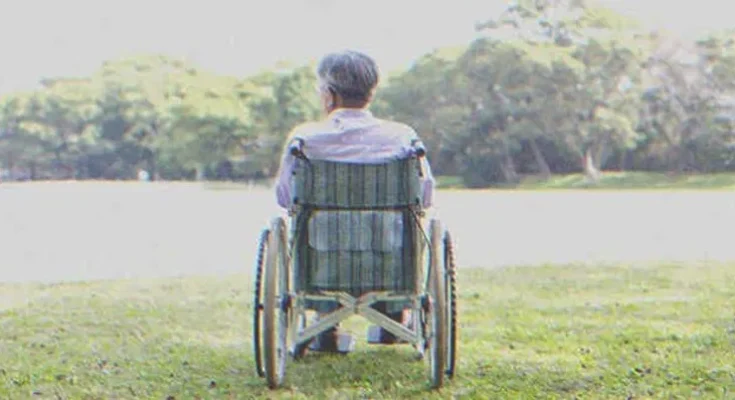 A man in a wheelchair | Source: Shutterstock