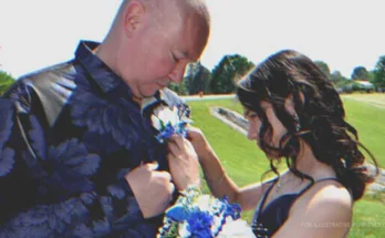 Young girl pinning flowers to an older man's shirt | Source: Shutterstock