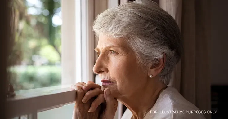 A senior woman looking out the window | Source: Getty Images