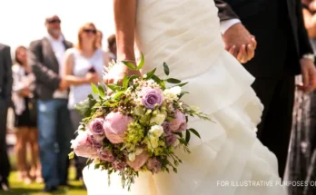 A bride and groom holding hands at their wedding | Source: Shutterstock