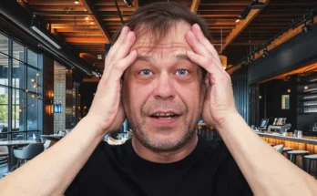 A shocked middle-aged man in a restaurant | Source: Shutterstock