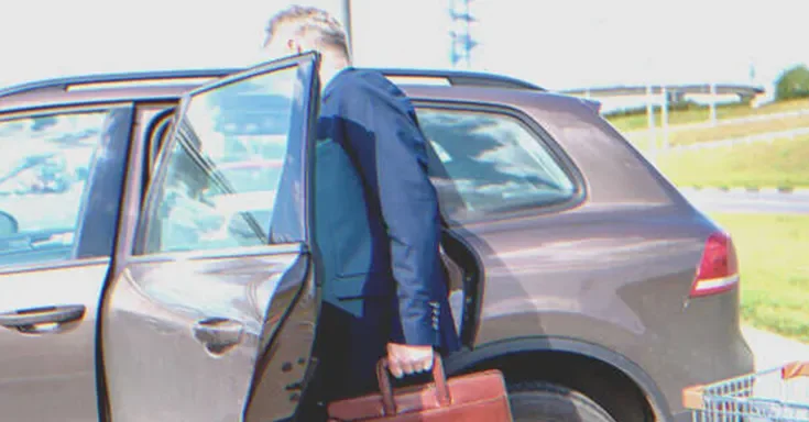 A man getting into a car | Source: Shutterstock