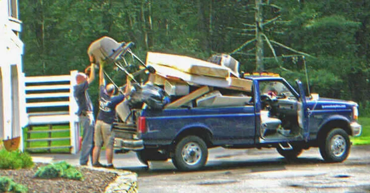 Men unloading furniture from a moving truck | Source: Flickr/cambodia4kidsorg (CC BY 2.0)