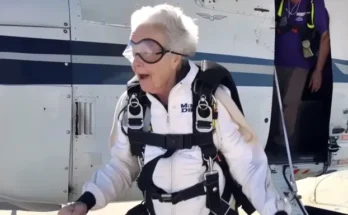 An older woman in skydiving gear | Source: Midjourney