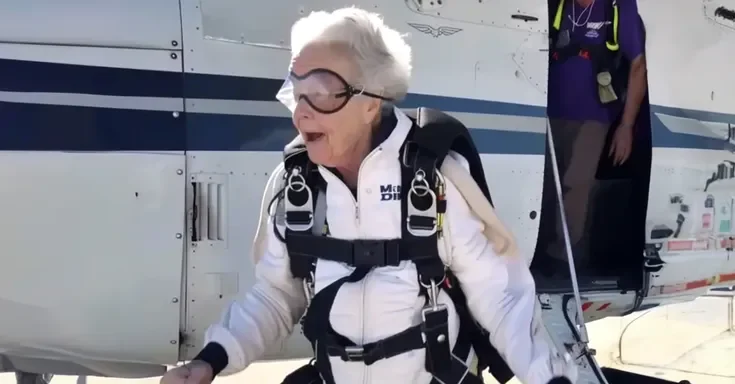 An older woman in skydiving gear | Source: Midjourney