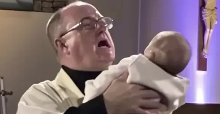 A shocked priest holding a baby | Source: Amomama