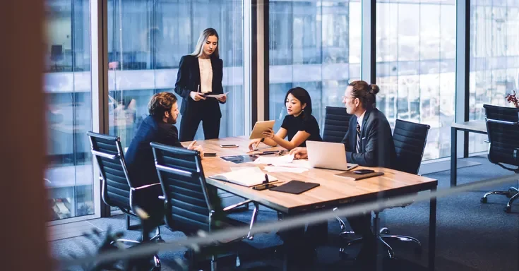 Office workers having a meeting | Source: Shutterstock