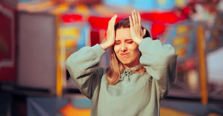 A worried woman at an amusement park | Source: Getty Images