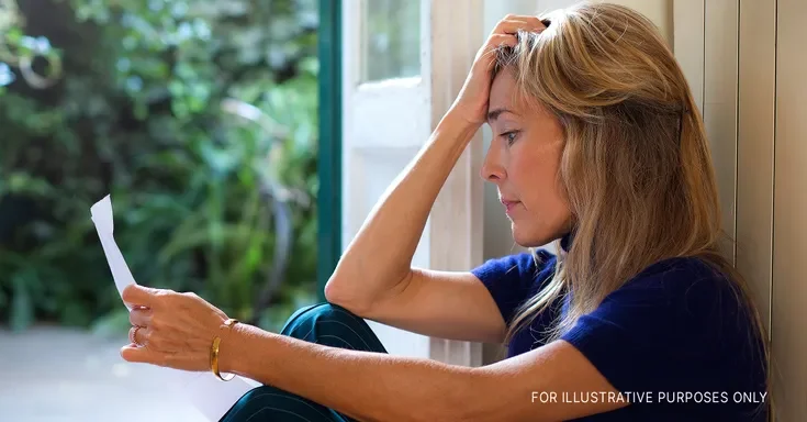 A woman reading a letter | Getty Images