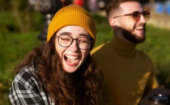 A close up of a laughing young woman | Source: Freepik