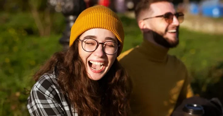 A close up of a laughing young woman | Source: Freepik