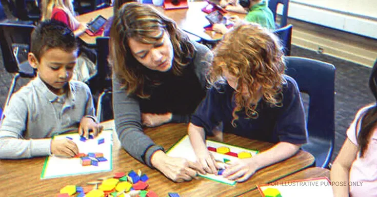 Teacher Helping Her Students. | Source: Getty Images