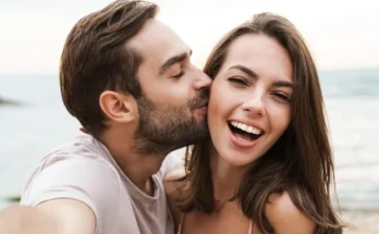 A smiling young couple | Source: Shutterstock