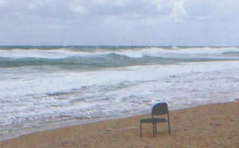 An empty chair on the beach | Source: Shutterstock