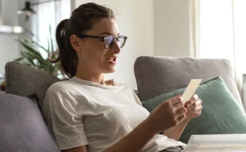 A woman looking at a photo | Source: Shutterstock