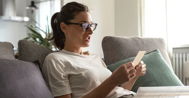 A woman looking at a photo | Source: Shutterstock