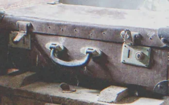 An old suitcase covered in dust | Source: Shutterstock