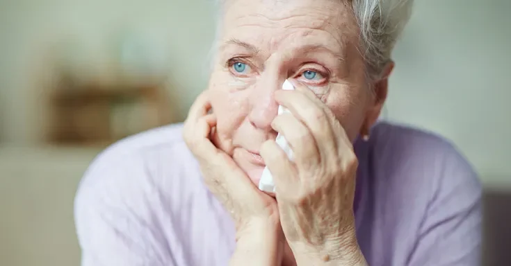 A senior woman wiping her tears | Source: Getty Images