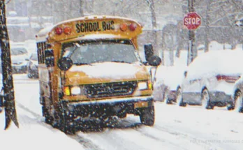 Bus Parked On The Road In Wintry Weather. | Source: Shutterstock