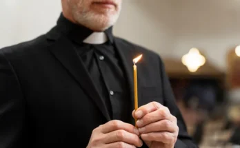 A priest holding a candle | Source: Freepik