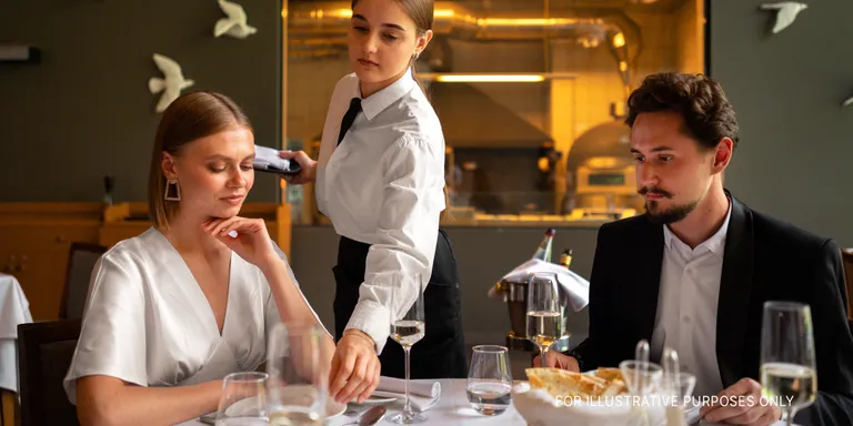 A couple in a restaurant | Source: Freepik