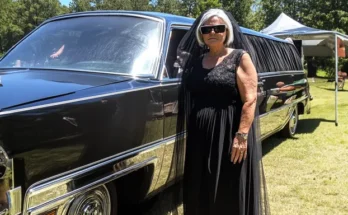 A woman standing near a hearse | Source: AmoMama