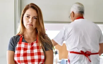 An upset woman in an apron | Source: Shutterstock