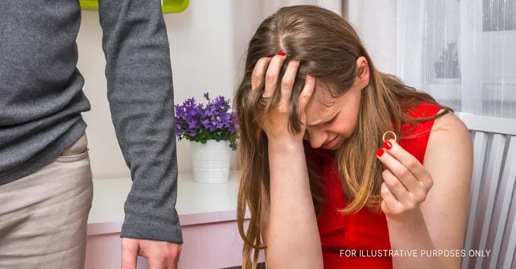 An upset woman holding a ring | Source: Shutterstock