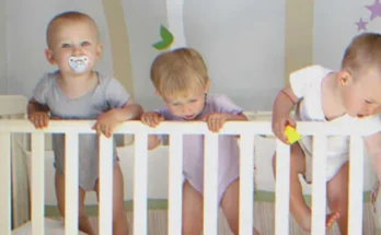 Triplets in a crib | Source: Shutterstock