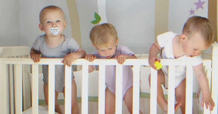 Triplets in a crib | Source: Shutterstock