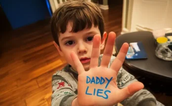 A boy with words written on his palm | Source: Amomama