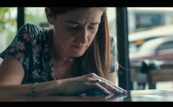 A sad woman looking at her ring | Source: Midjourney