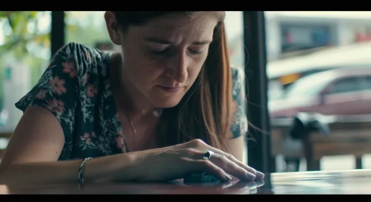 A sad woman looking at her ring | Source: Midjourney