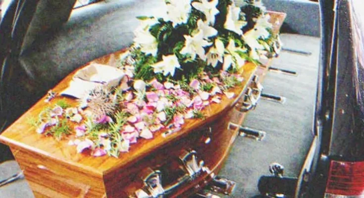 A coffin in a hearse | Source: Shutterstock