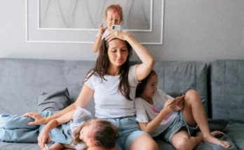 A mother with her three kids | Source: Shutterstock