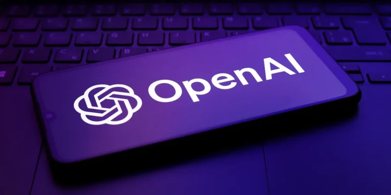 A photo of an OpenAI logo on a phone. | Source: Getty Images