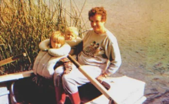 A woman with two little kids on a boat | Source: Shutterstock