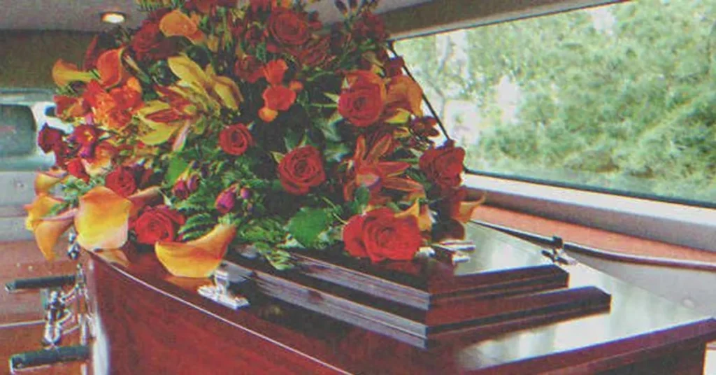 Flowers on top of a coffin | Source: Shutterstock