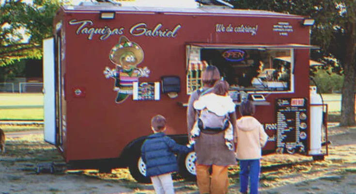 A family in front of a food truck | Source: Shutterstock | Getty Images