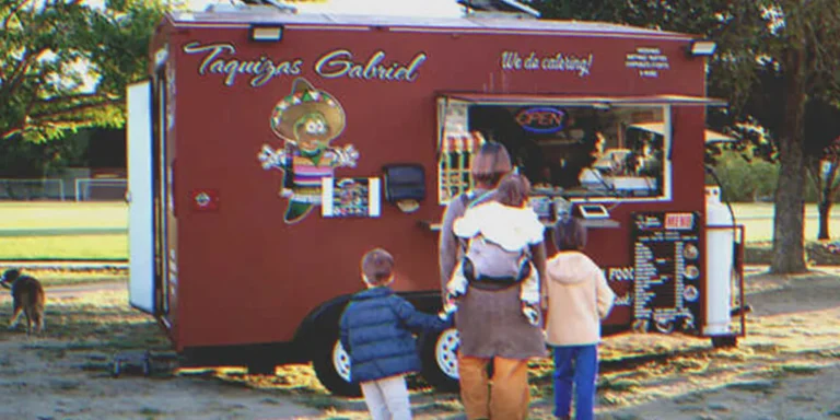 A family in front of a food truck | Source: Shutterstock | Getty Images