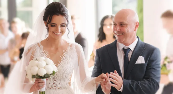 A man walking his daughter down the aisle | Source: Shutterstock